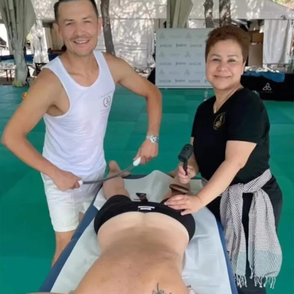 Daniel Hamilton performing a massage therapy session