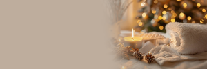 spa scene with candles, pine branches, and wellness ambiance