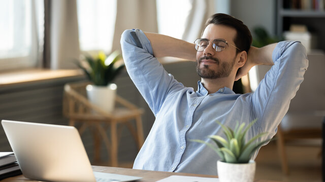 Employee relaxing at desk to support corporate wellness programs and employee burnout prevention