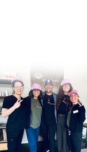 Wellness team posing together highlighting corporate wellness programs as a leadership strategy