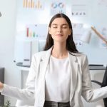 Mindfulness practice in the office representing wellness as leadership strategy in modern corporate wellness programs